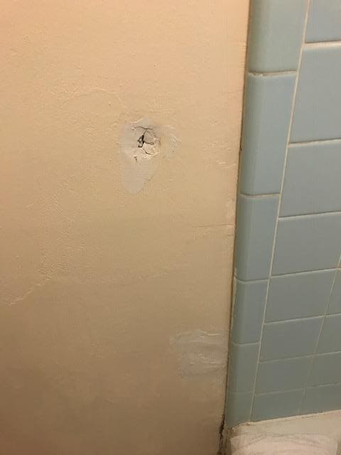 Holes in bathroom wall
