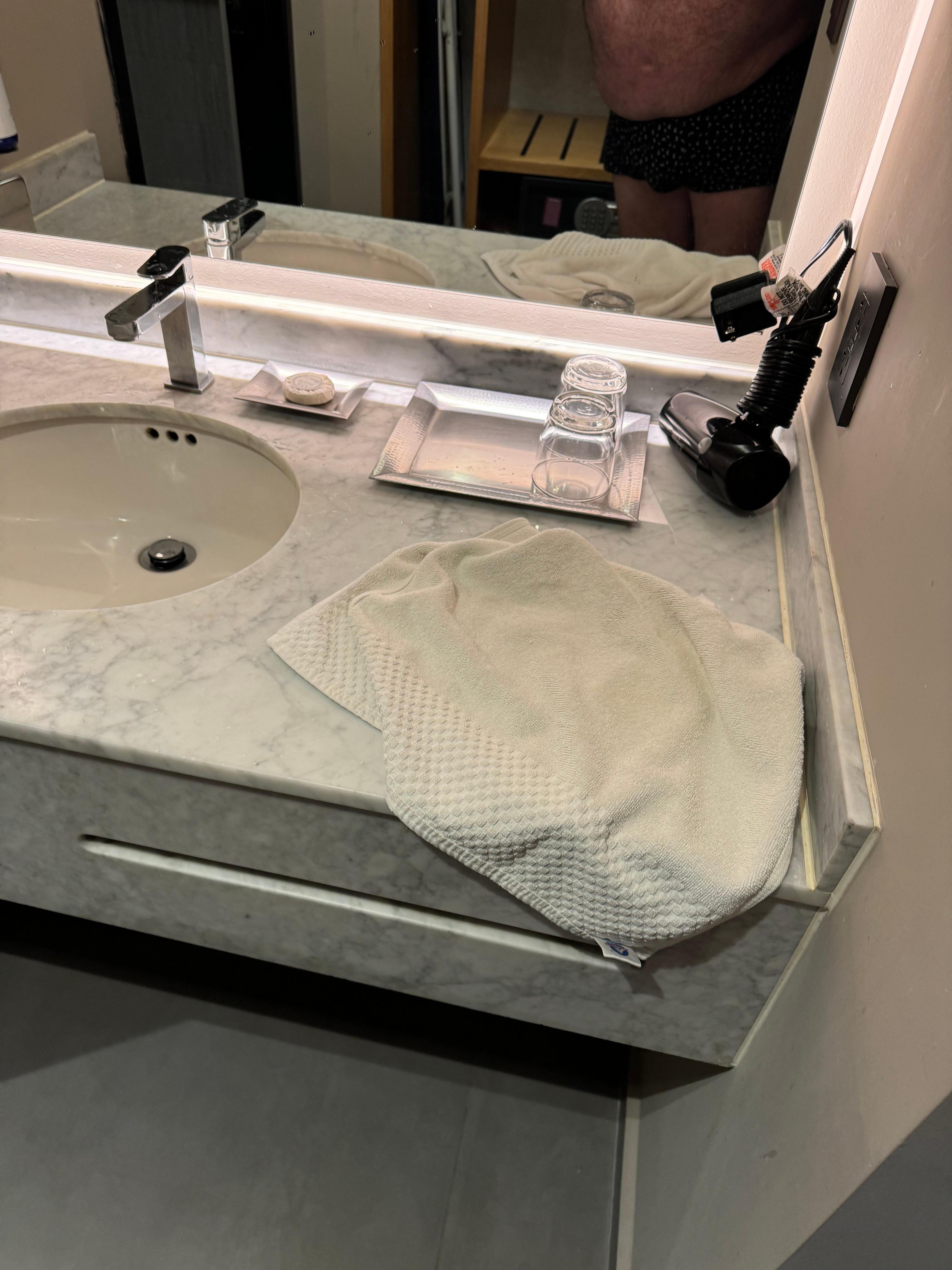 Just one hand towel, and one bath towel, no shower floor mat