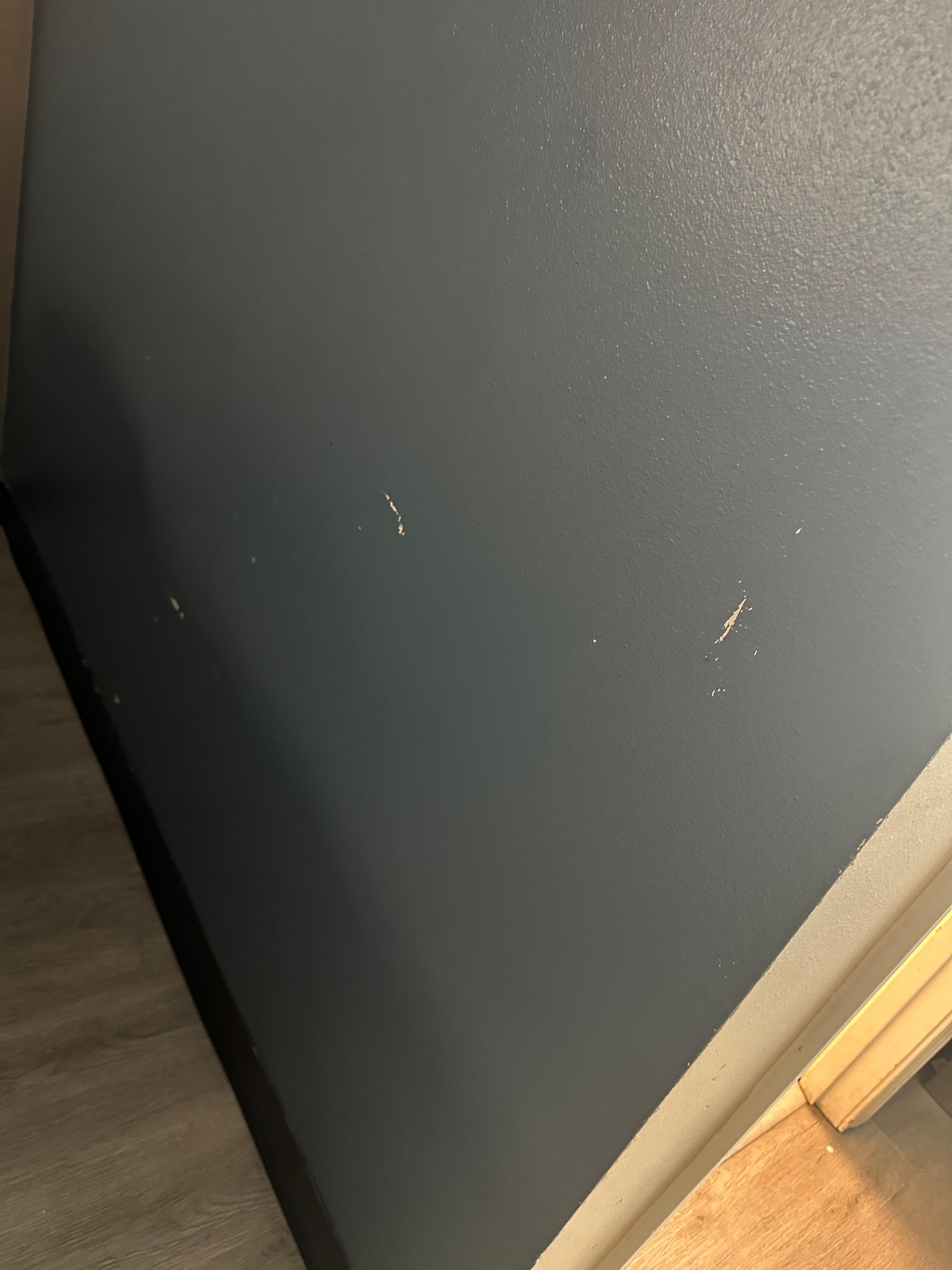 Paint chips all over the room like this