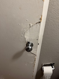 Broken bathroom door.