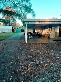Outdoor gathering space complete with fire pit and grill
