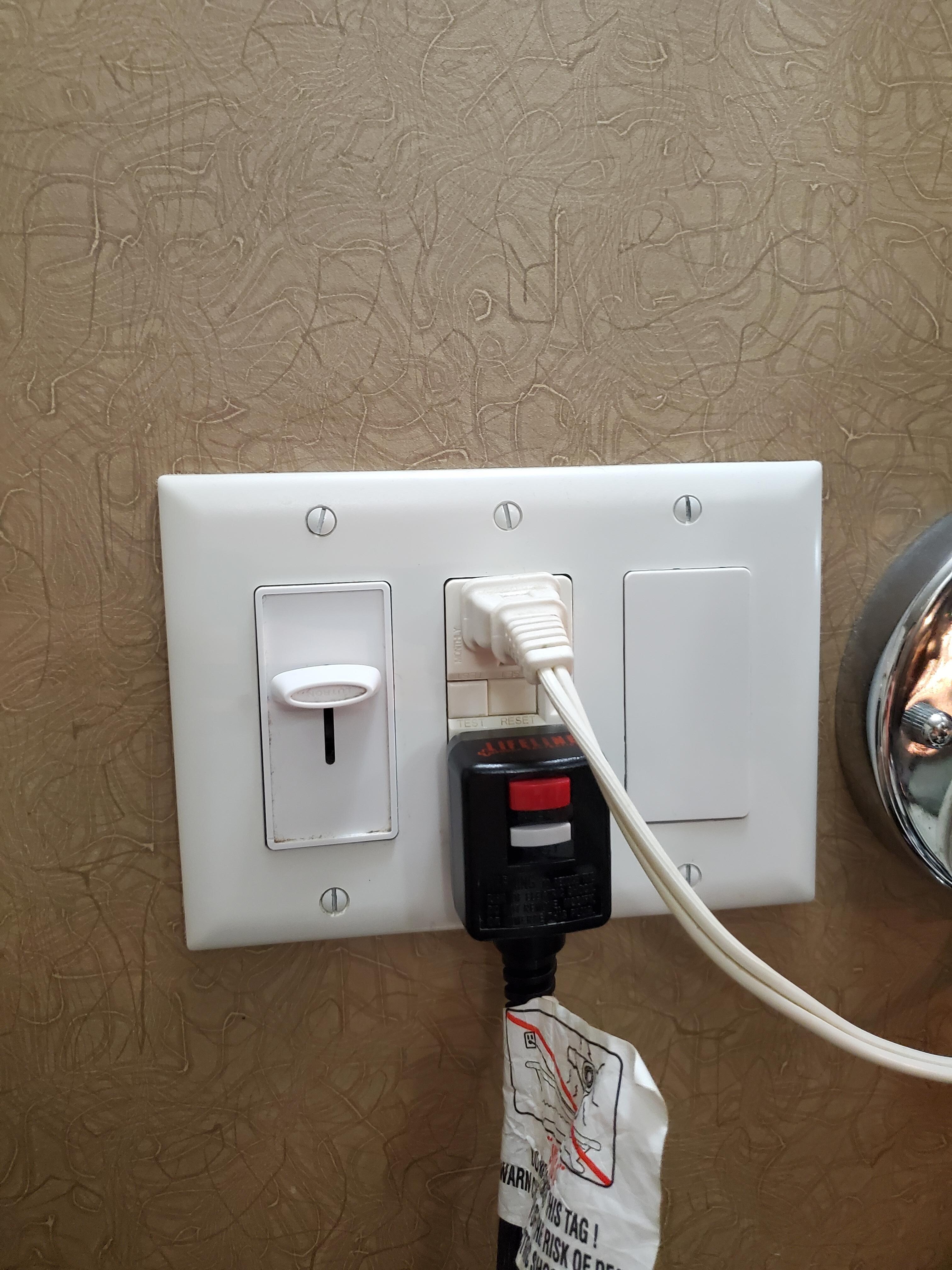 Plug for makeup mirror but fake plug for fan. 