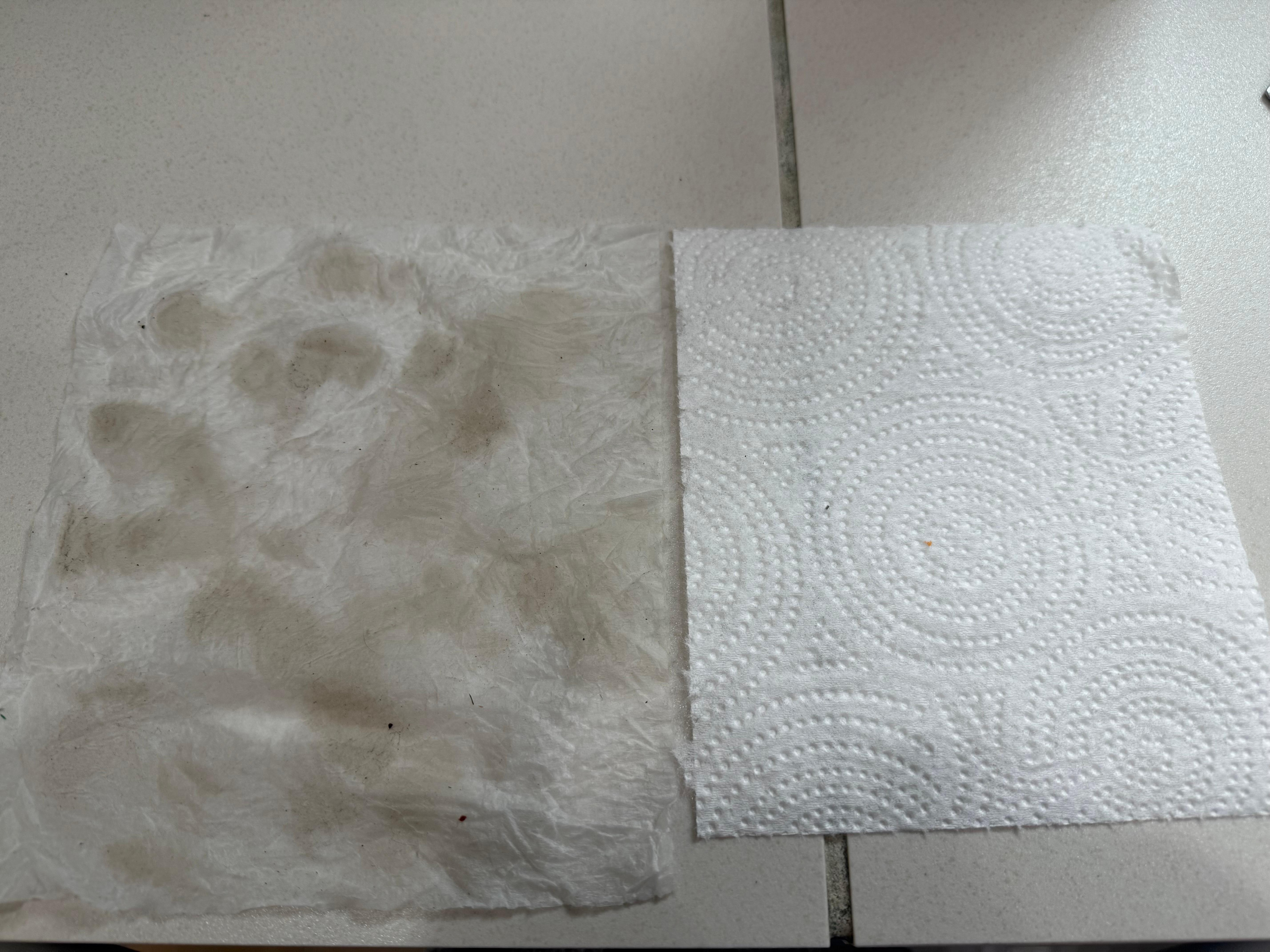 Left pic dirt from wiping floor by fridge and right is a clean paper towel for comparison 