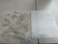 Left pic dirt from wiping floor by fridge and right is a clean paper towel for comparison