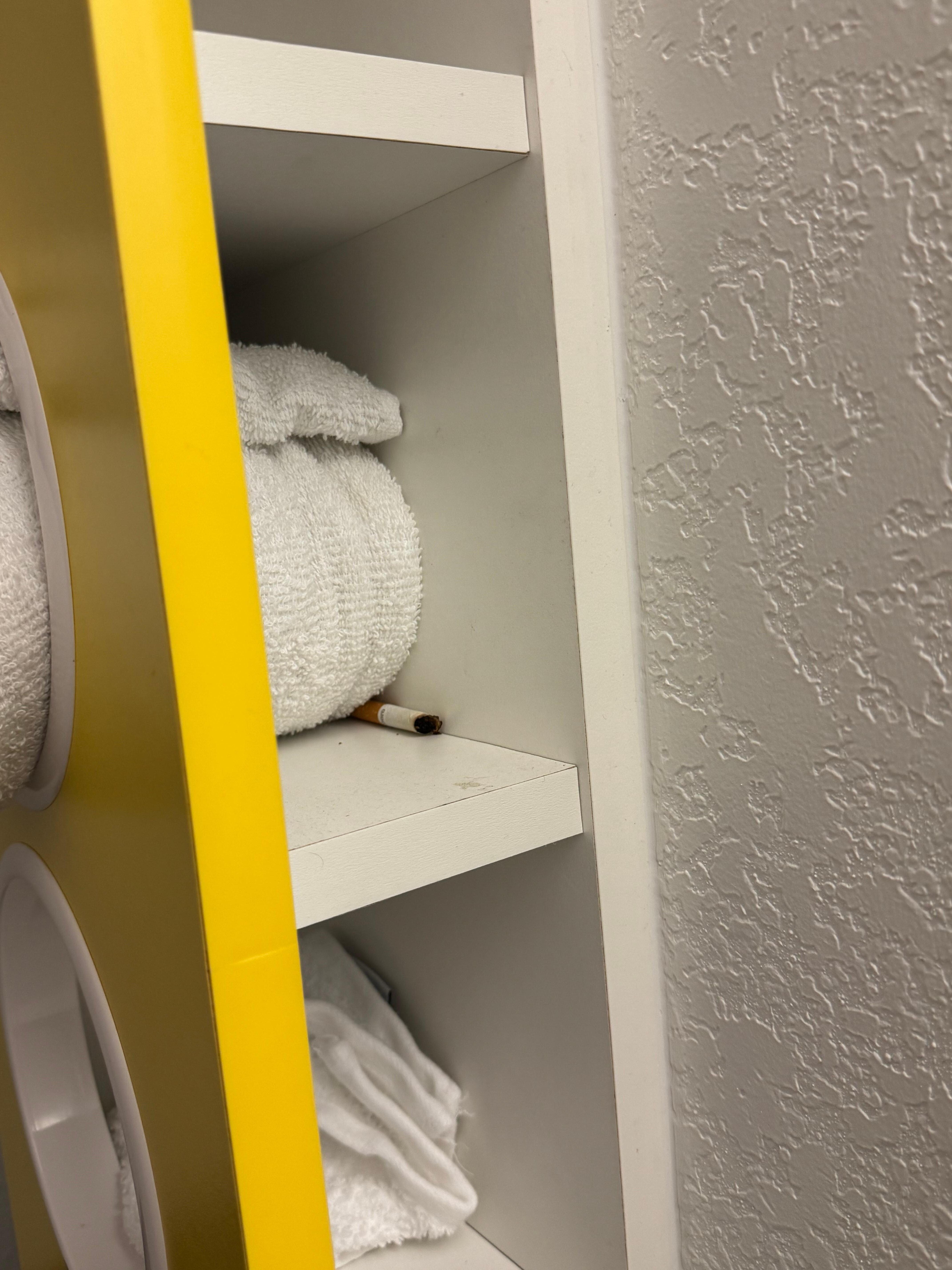 Half smoked cigarette on the towel rack