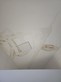 Water damage in the ceiling of the bathroom