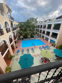View of pool courtyard from 3rd floor room.