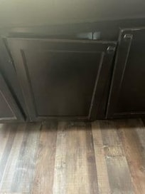 Hanging cabinet door in kitchen.