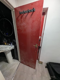 The sad face drawn in dust on the door says it all.