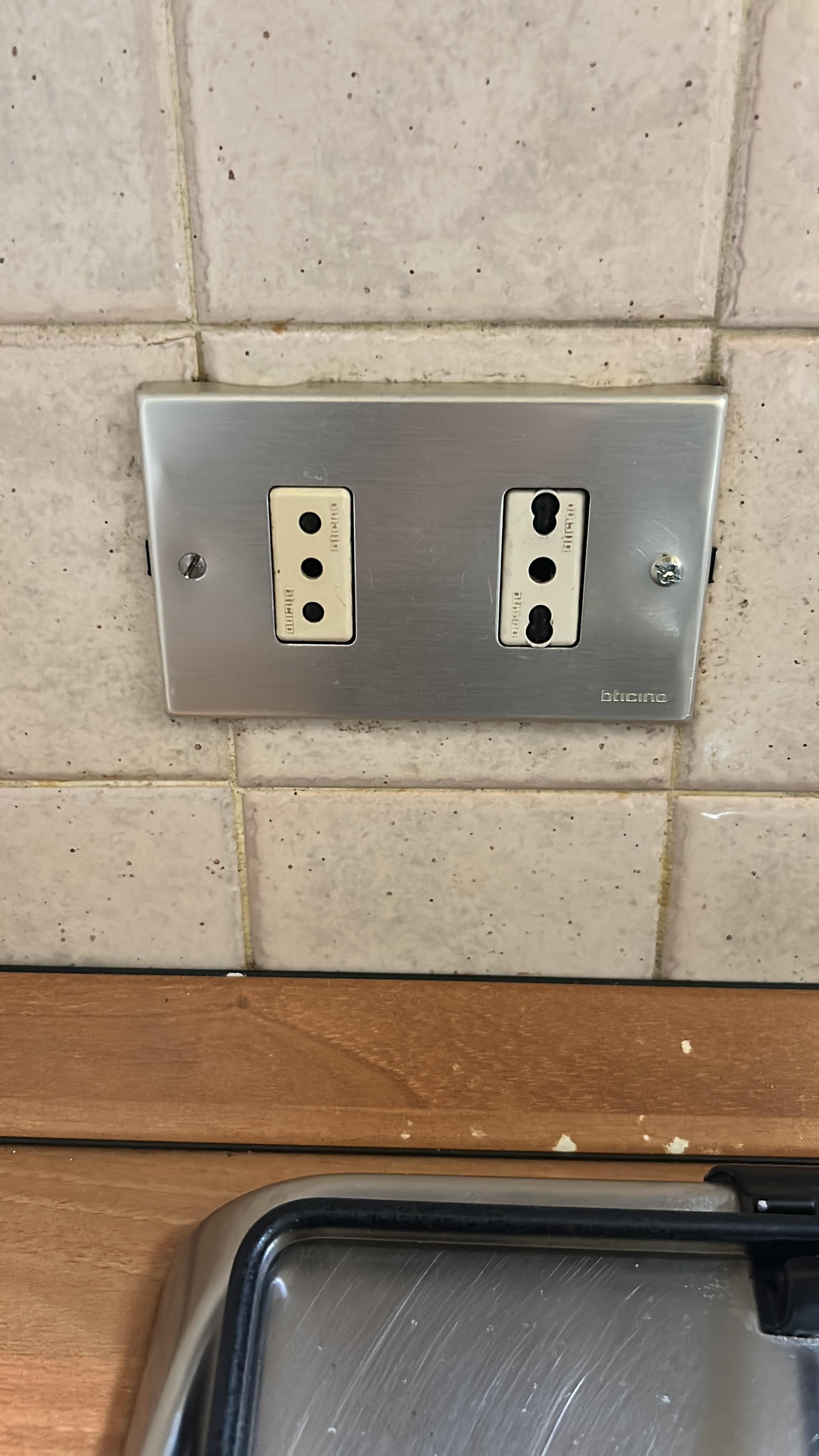These electric outlets were thinner prongs than those available in Milan (with our universal converter)