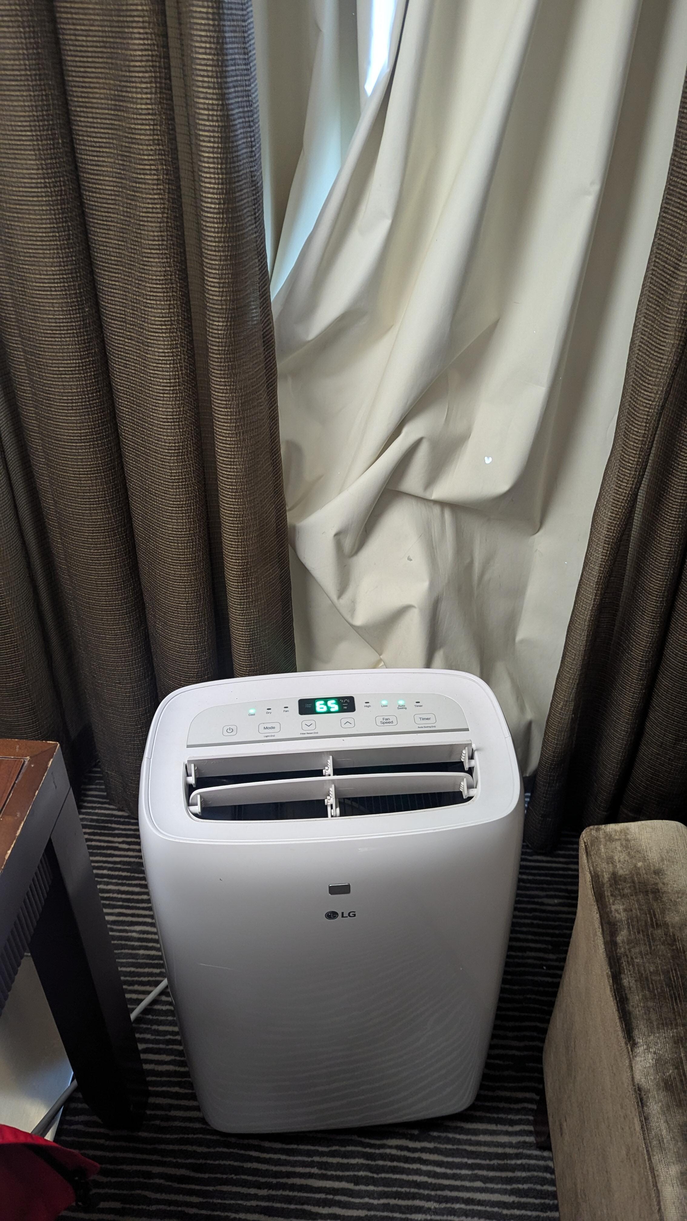 Sadly, a portable air conditioner to keep room cool.
