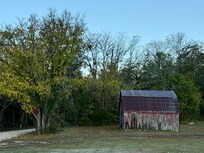 A neat old barn often the distance from the cabin