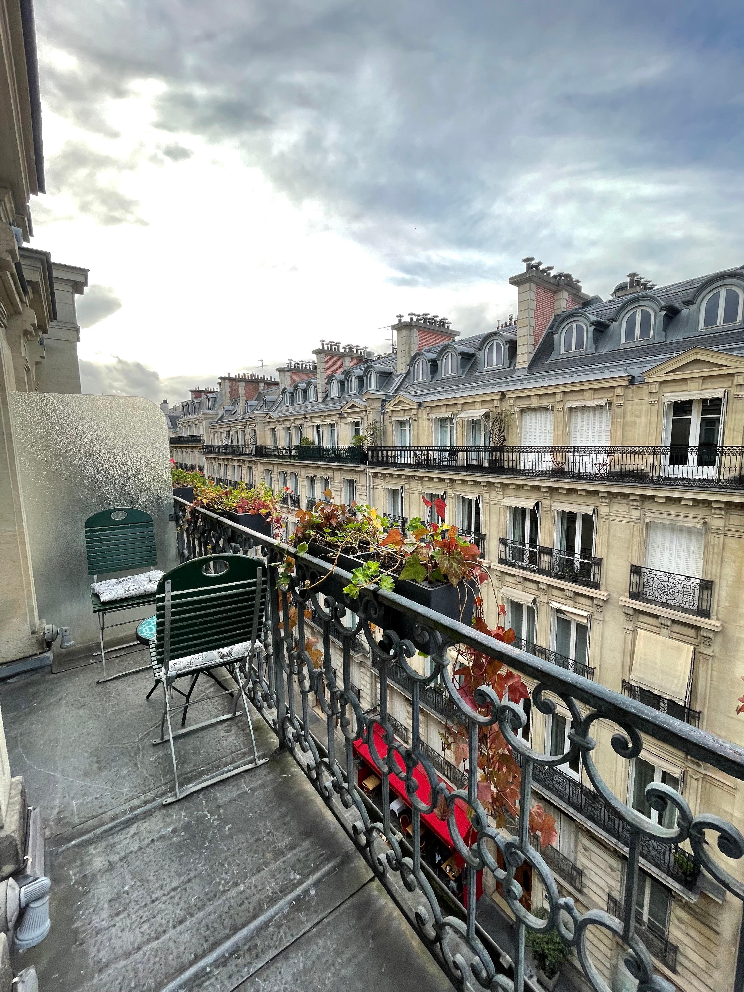 Cute little balcony with table and chairs