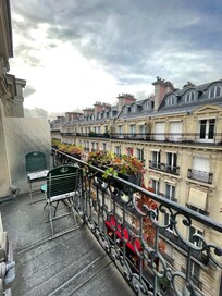 Cute little balcony with table and chairs