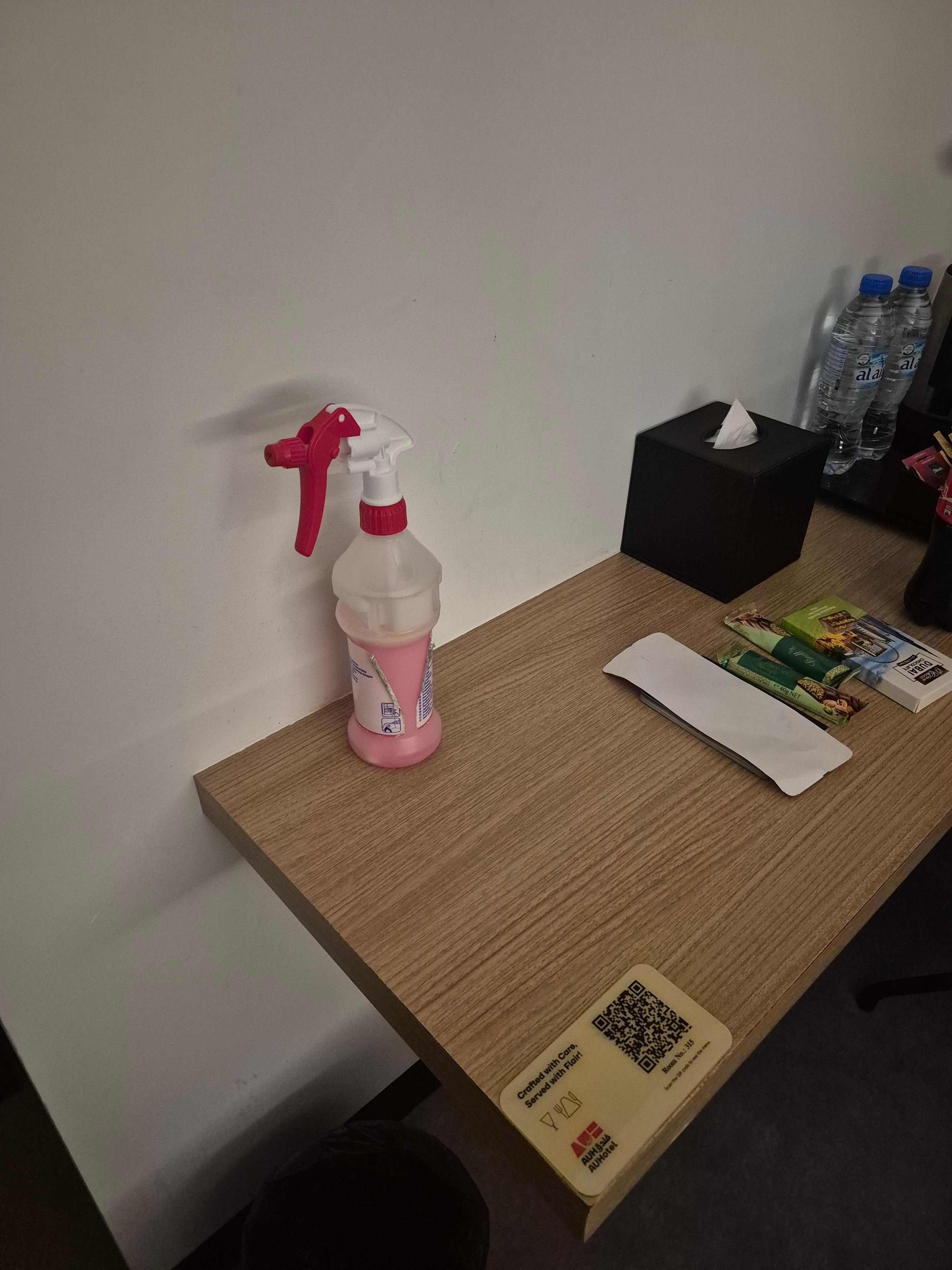 Cleaning spray sitting on the table when we checked in