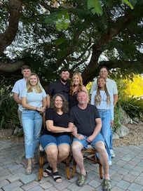 Out front, by the oldest tree on the island.