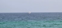 A sailboat off in the distance.