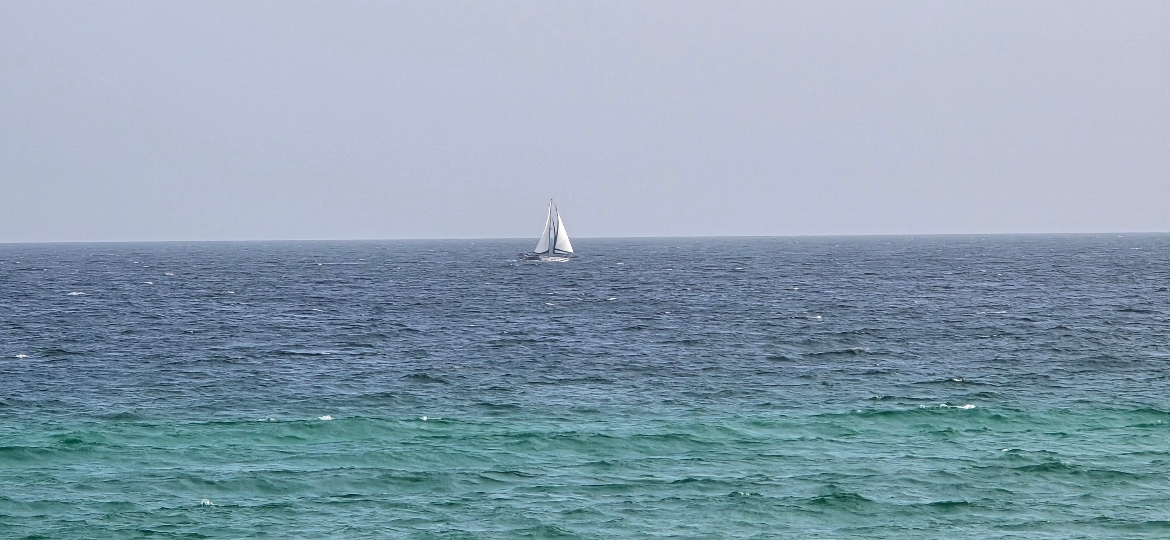 A sailboat off in the distance.