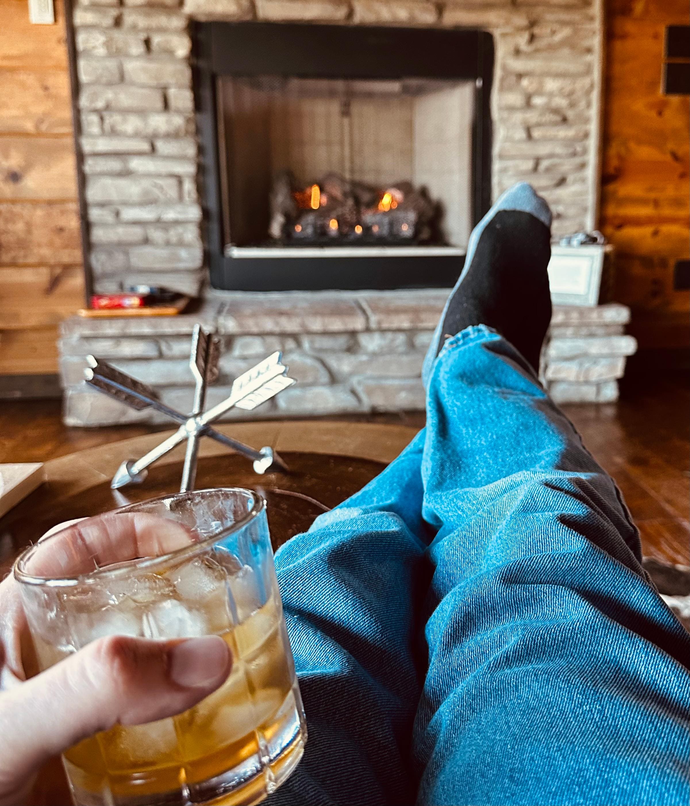 Relaxing with a drink by the (super-easy to use) gas fireplace
