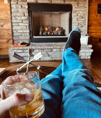 Relaxing with a drink by the (super-easy to use) gas fireplace