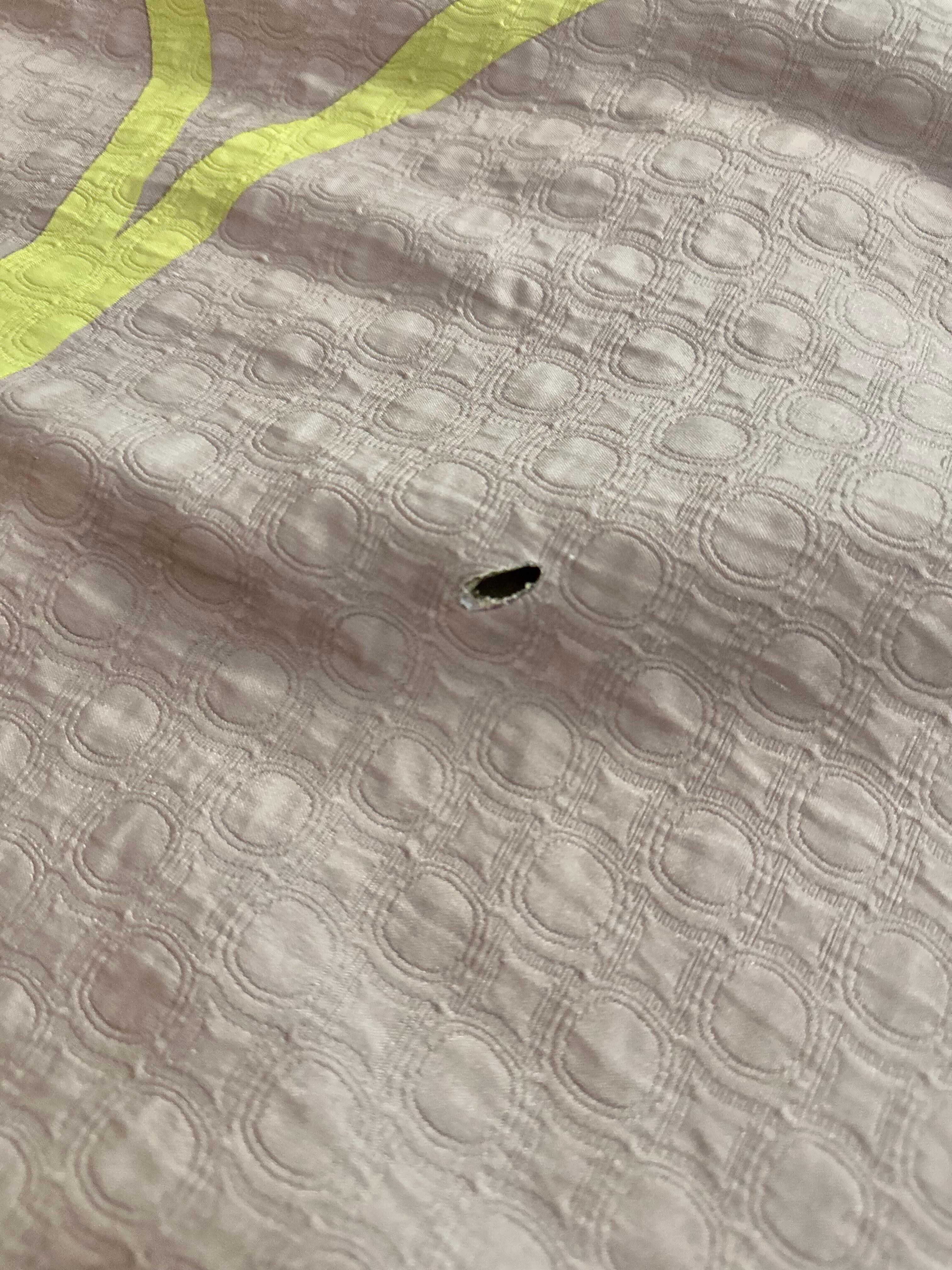 Cig Burns in Comforter