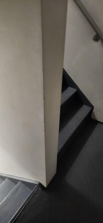 The is the "hallway" to the room. Walking through a darkened stairwell with a minor. And bags. Arms full. Defenseless.