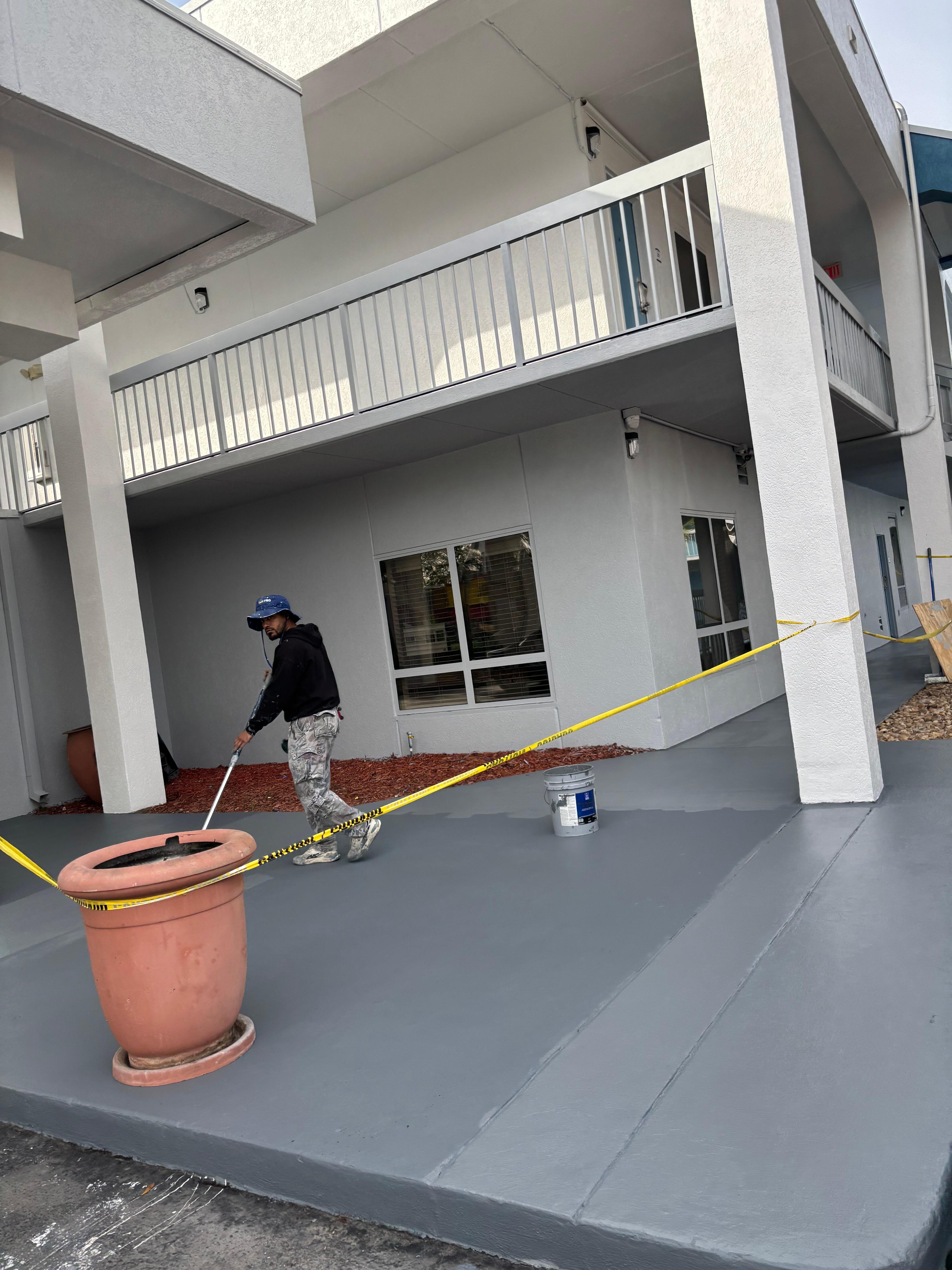 Paint vendor painting while business is open & customers checking in