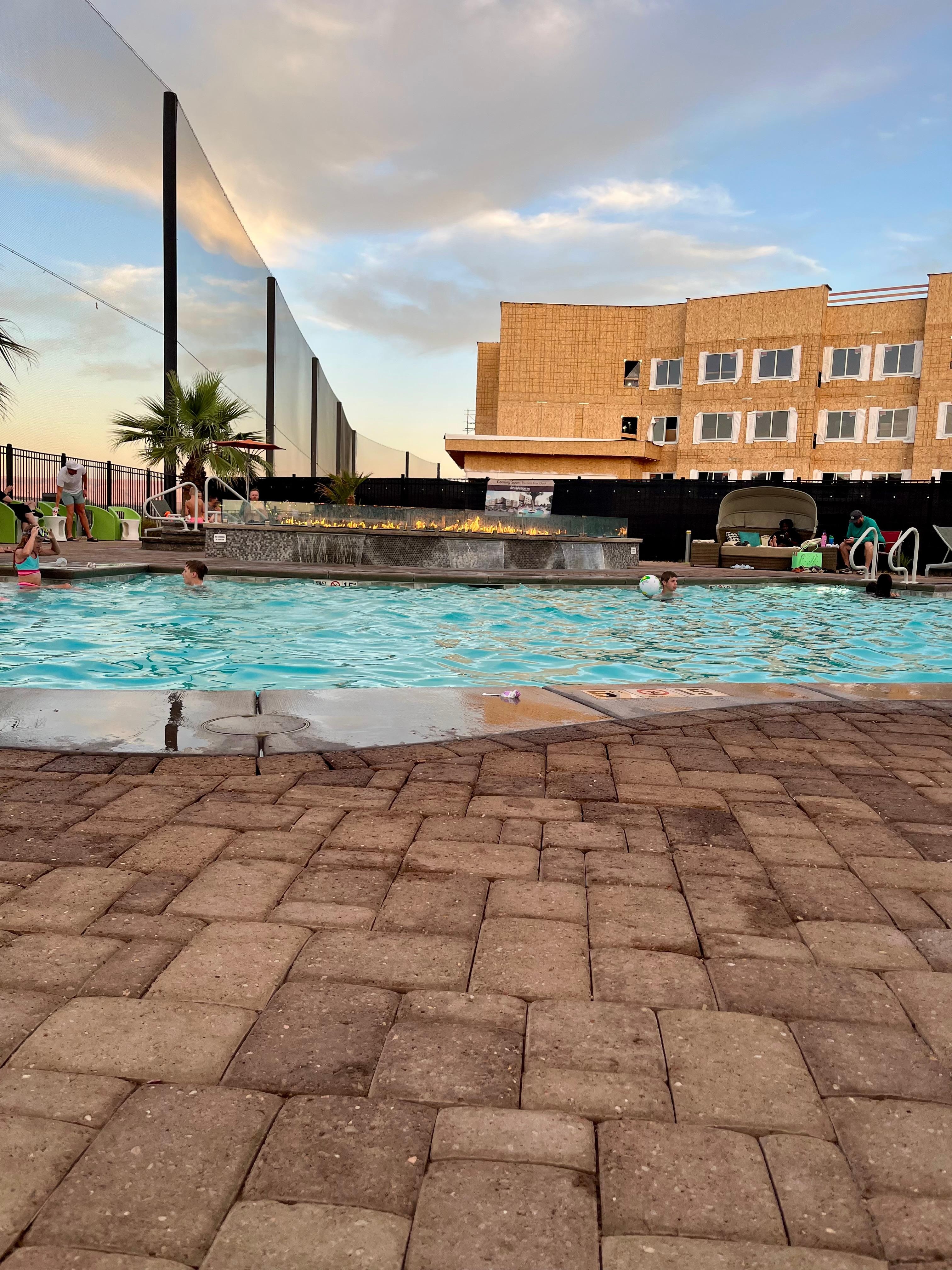 Pool area, new residence inn being built next door + beside a beautiful golf course