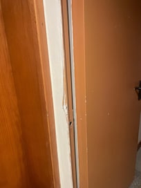 Damaged framework along the corridor to rooms