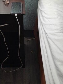 Cigarette butt next to bed