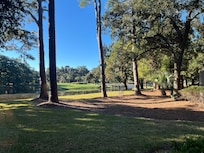 Nice view of golfers teeing off into the water. : )