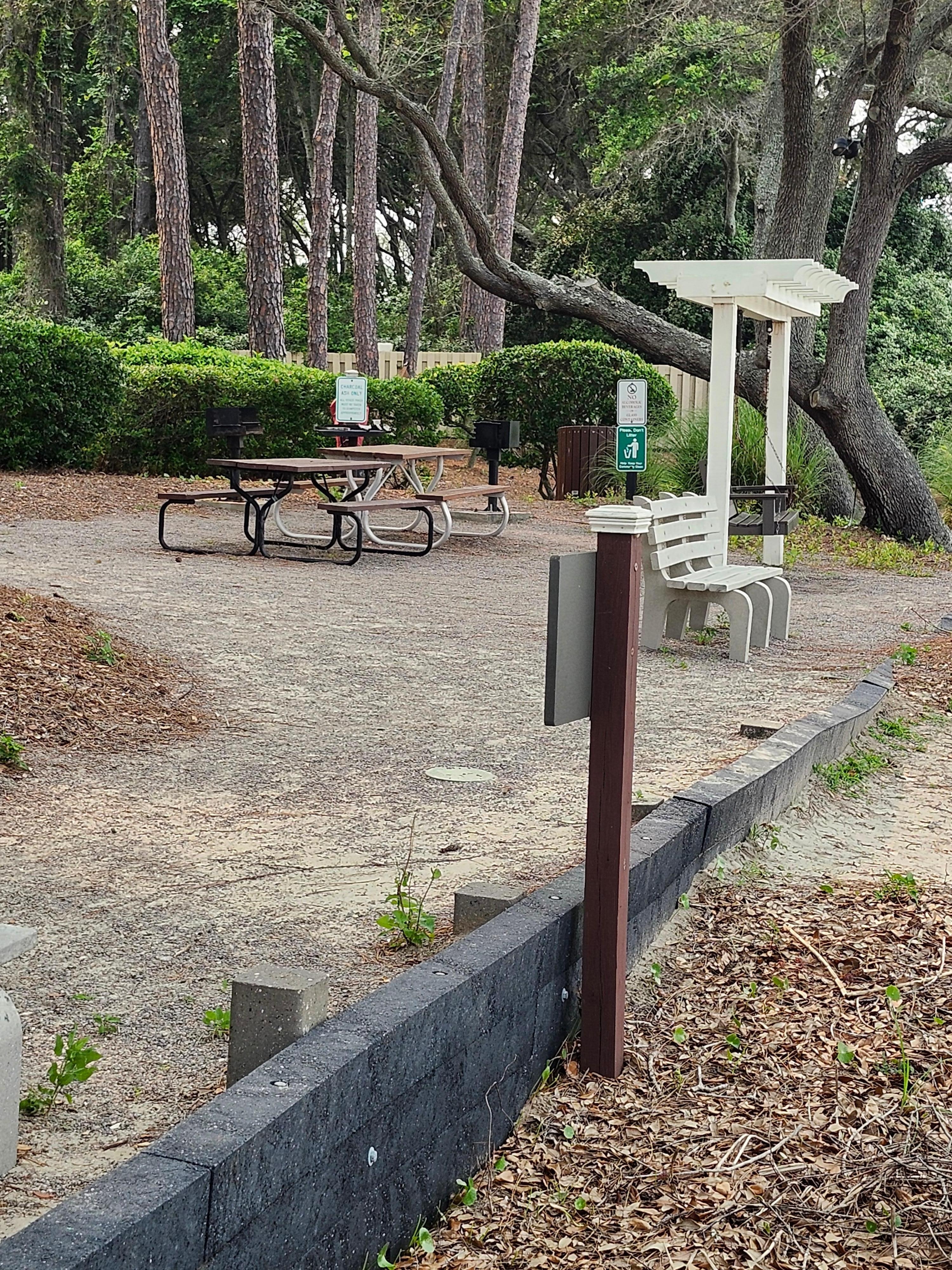 Set of picnic tables and grills
