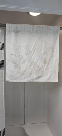 Towel after wiping up a small spot of water while carrying things in....