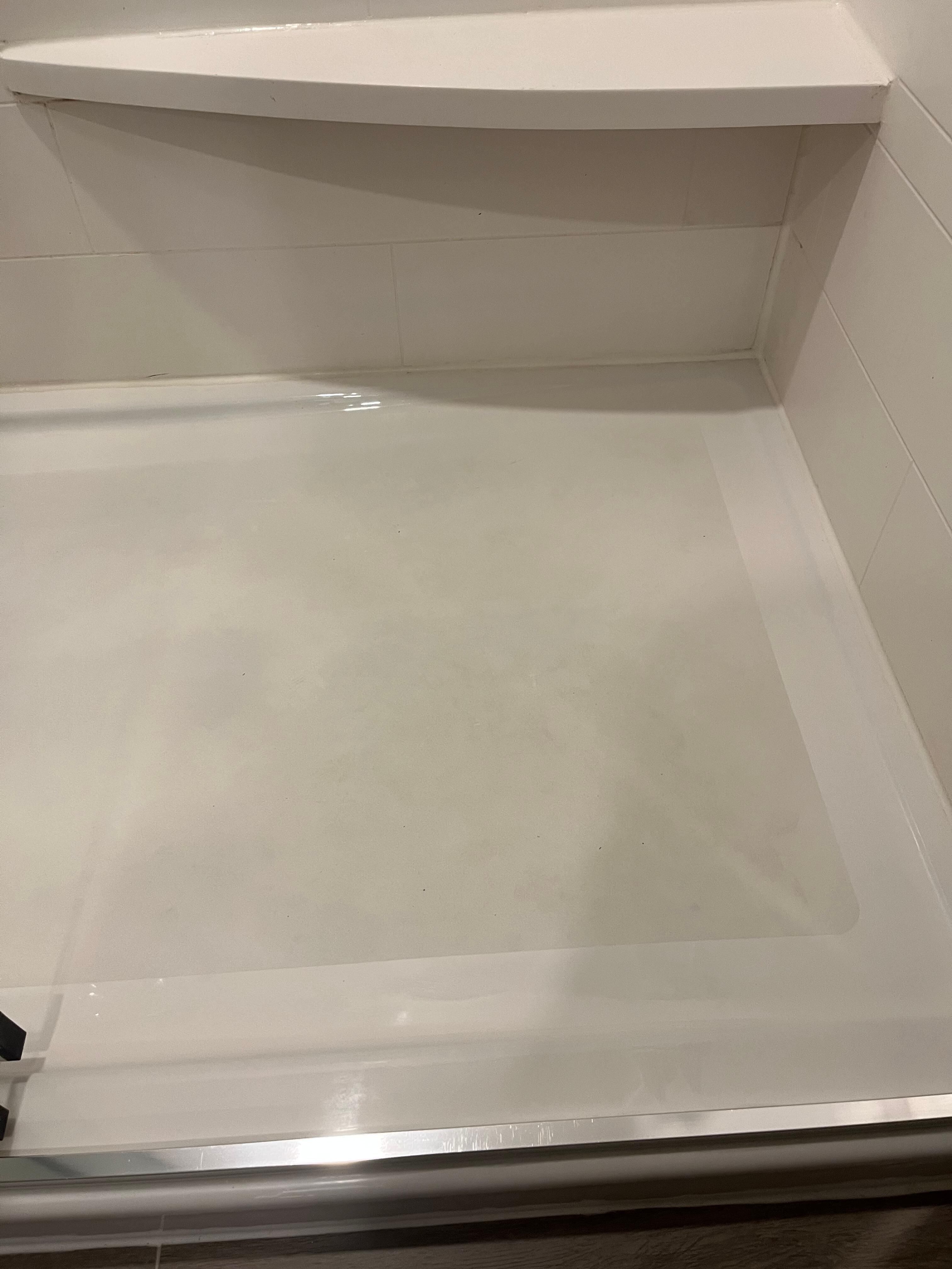 Some grime on shower base