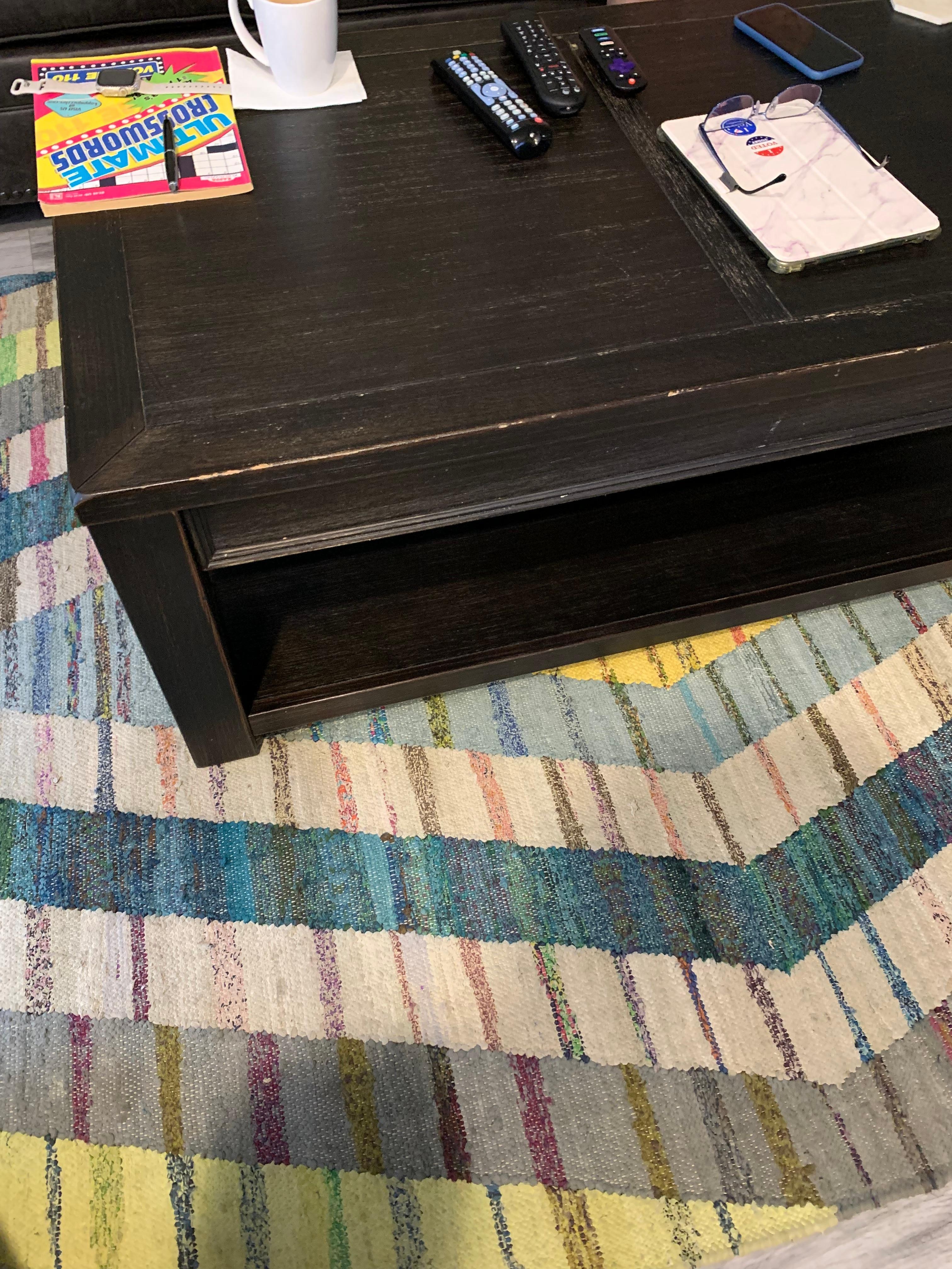 Coffee table has nicks on all edges