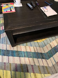 Coffee table has nicks on all edges