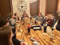 We played a murder mystery game at the large table. So much fun.