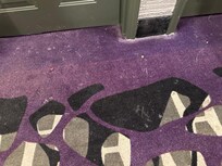 Dirty hallway carpet.