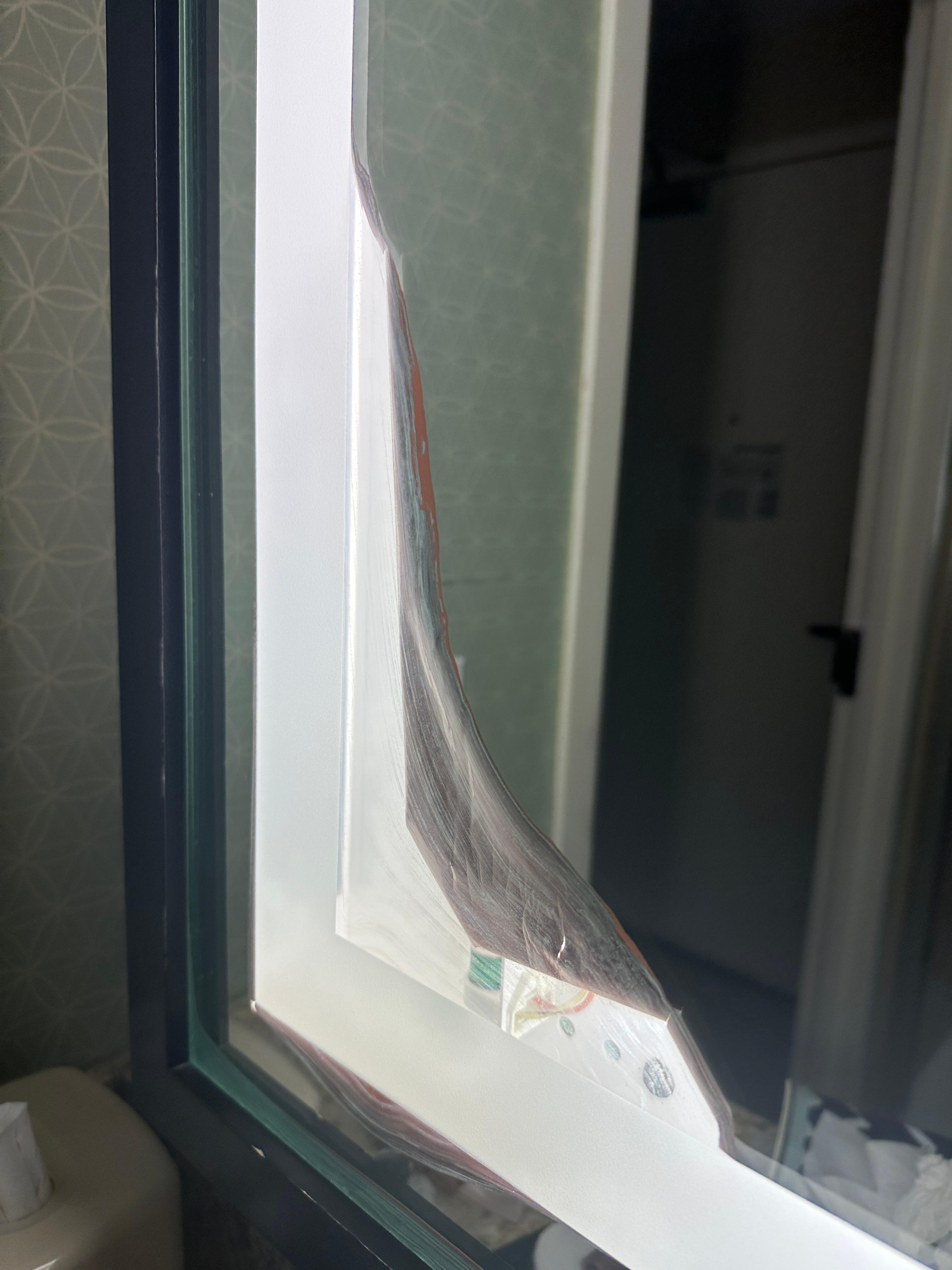 Broken bathroom mirror