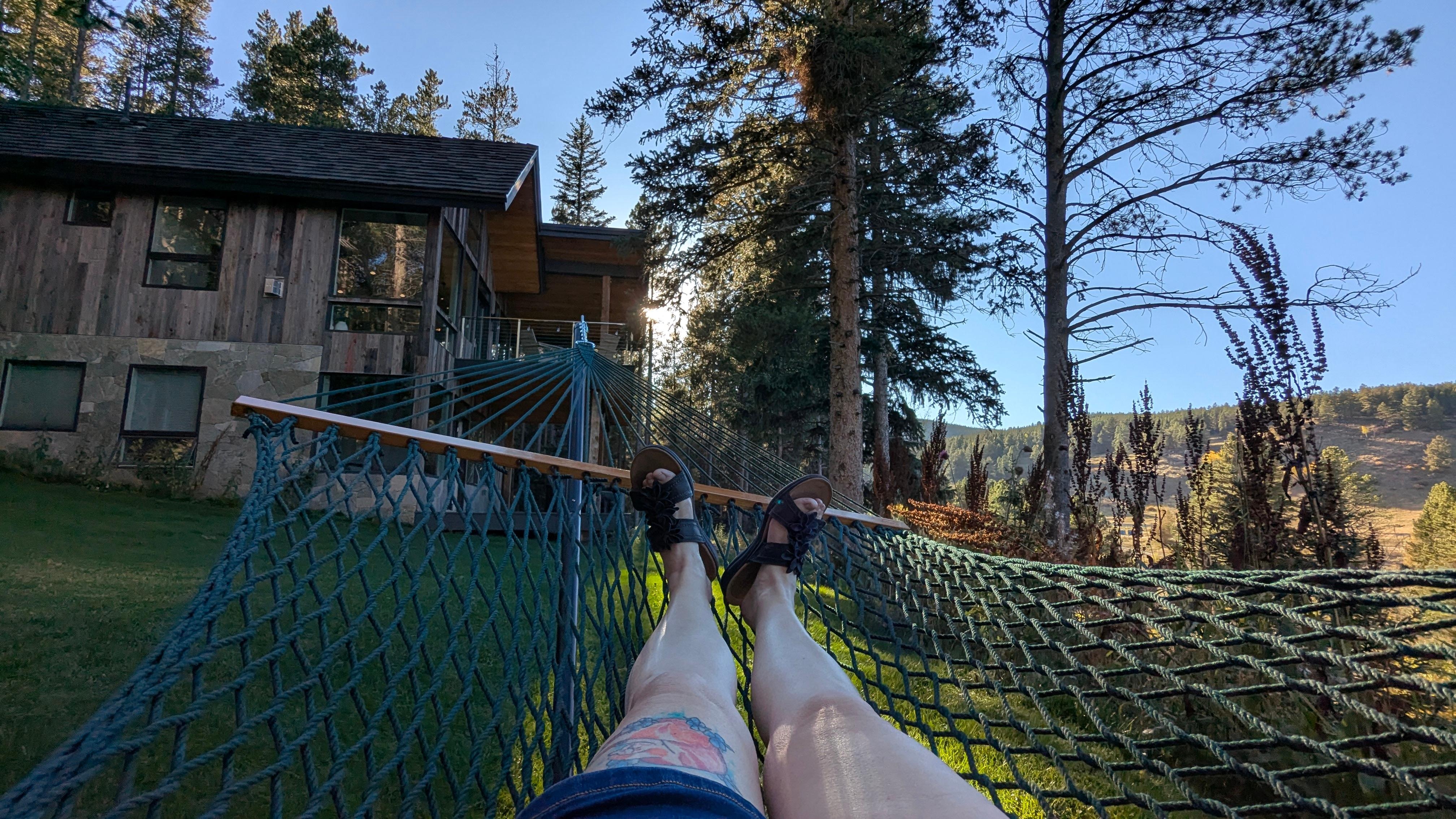 View of cabin from hammock in the lush yard.  Ground is spongy due to moles which you never see except for their holes.