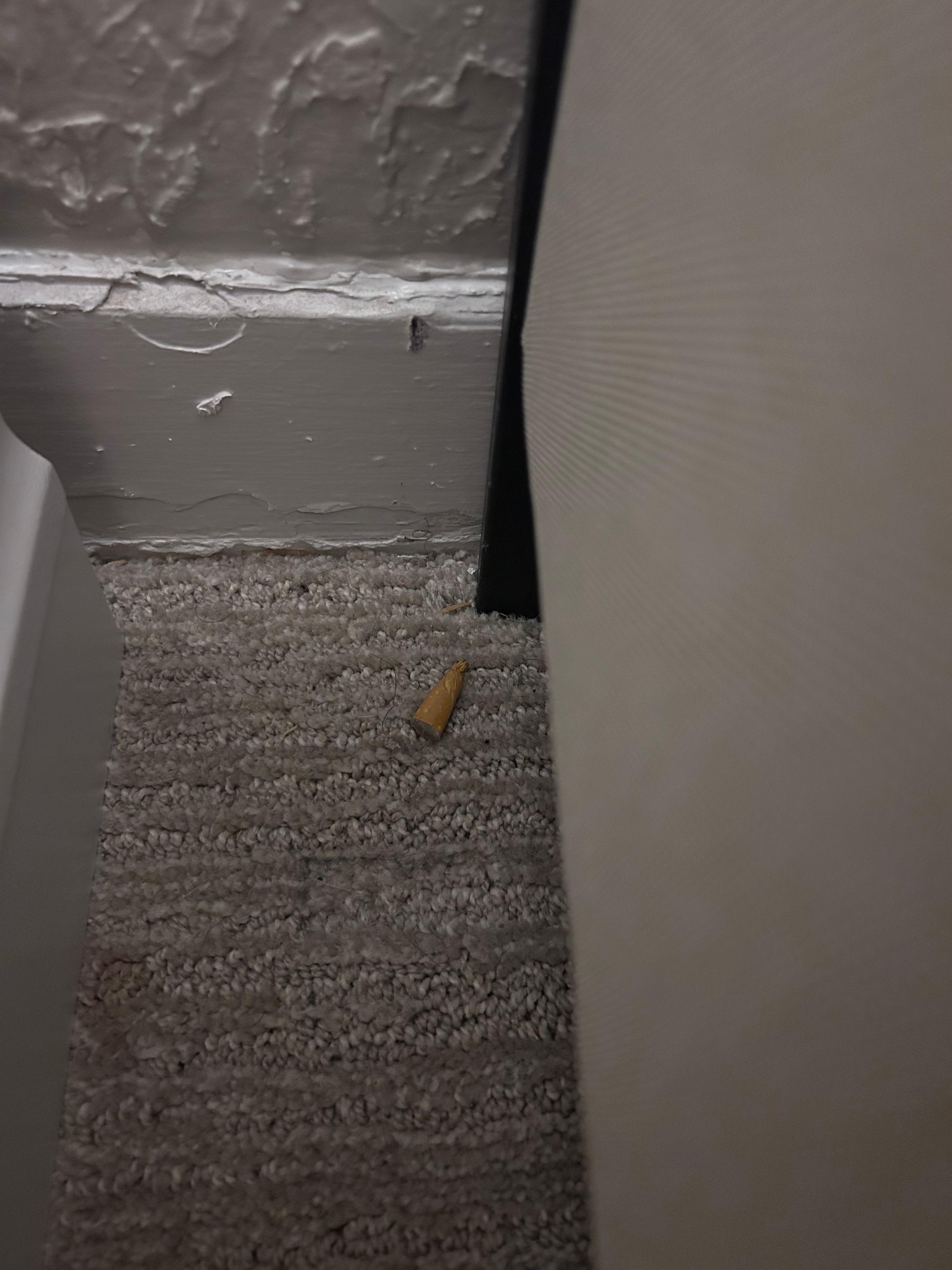 Cigarette butt next to the bed