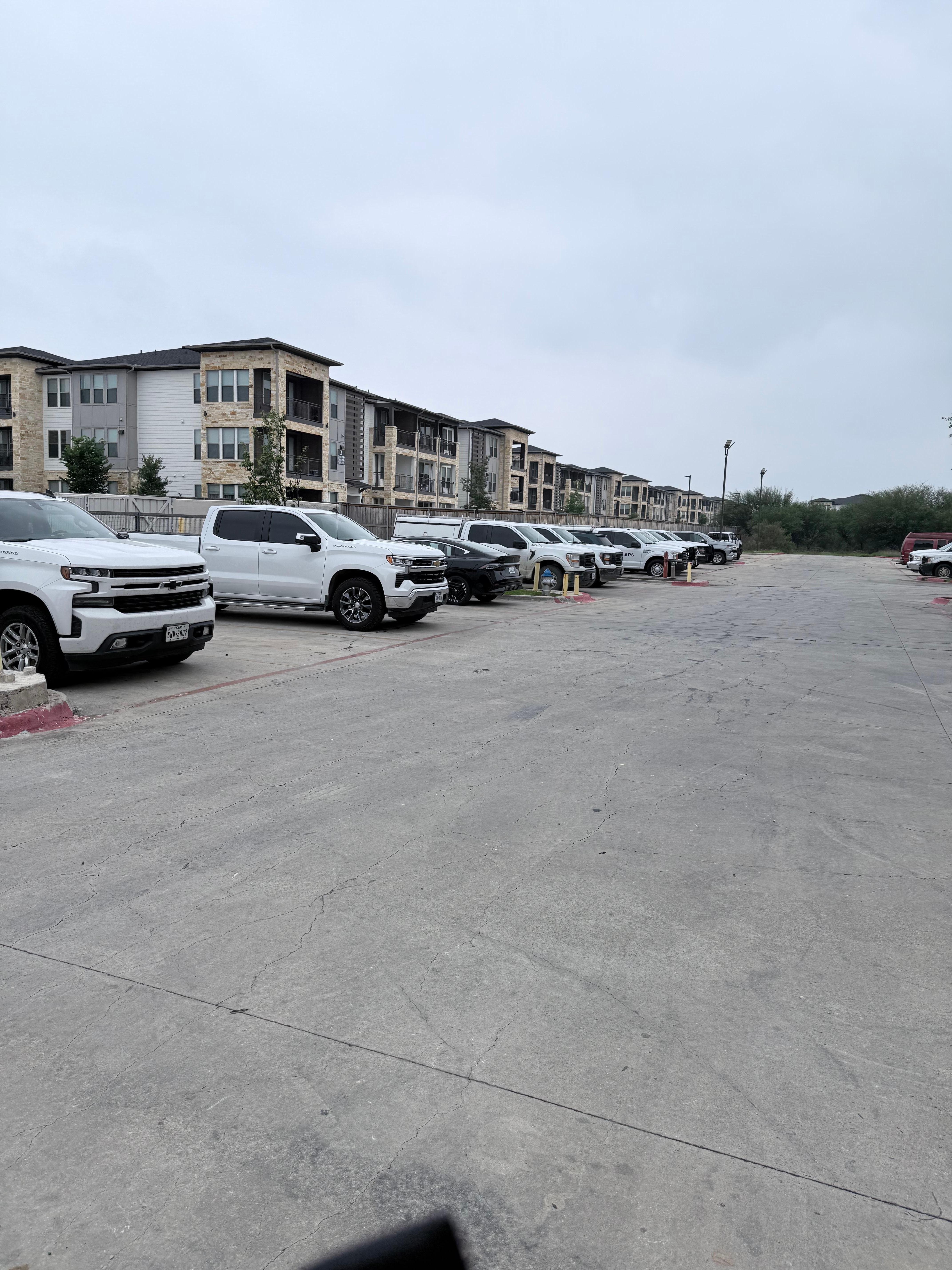 Parking lot full of coworker trucks 