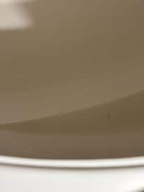 Black pubic curls throughout the tub
