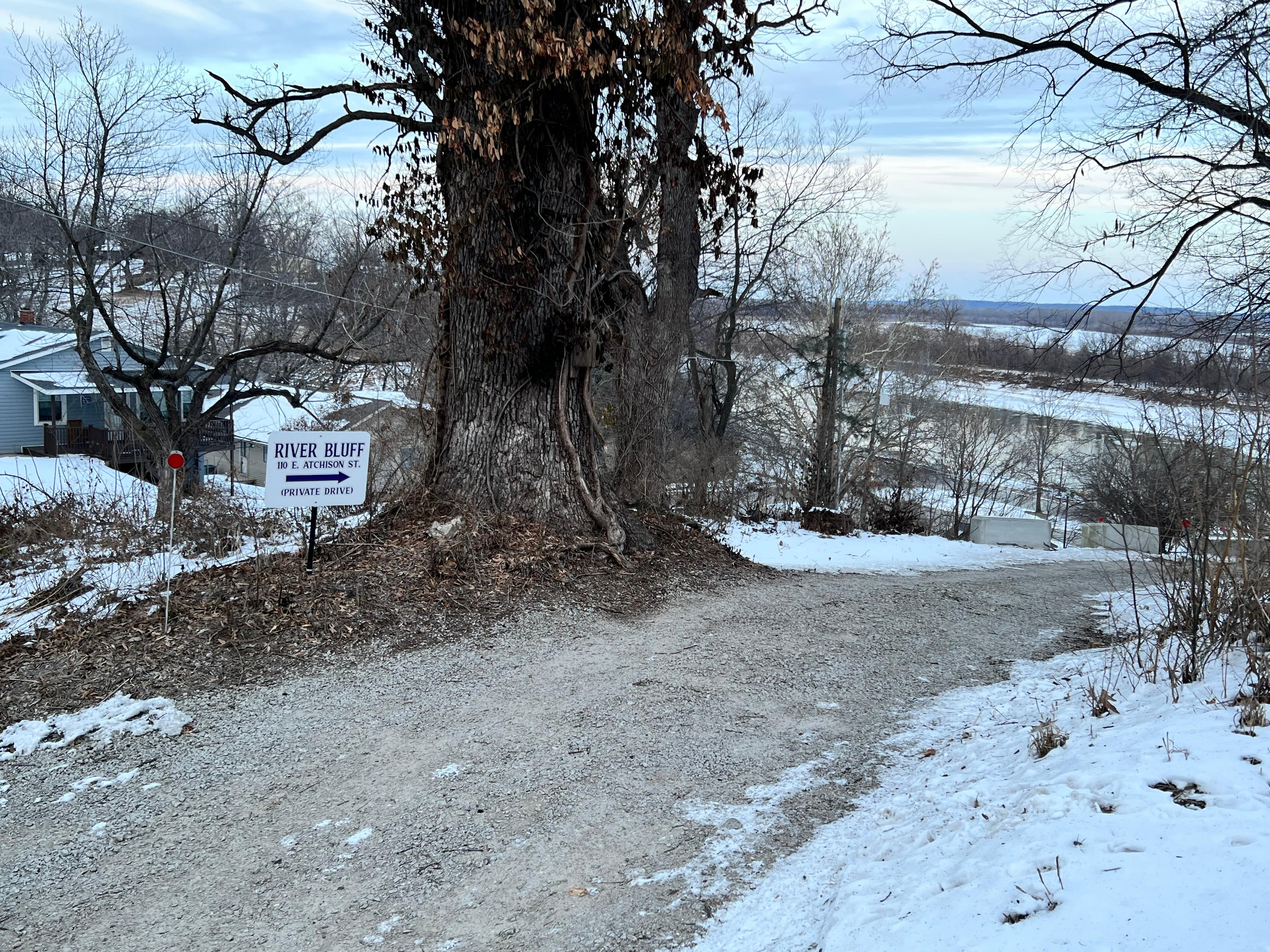 Driveway entry. Note white sign indicating entrance 