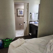 This is the first bed you walk to. To the left is the unattached sink then a sliding door to the toilet and shower stall.