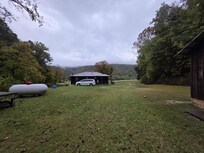 Open grass area in the backyard.