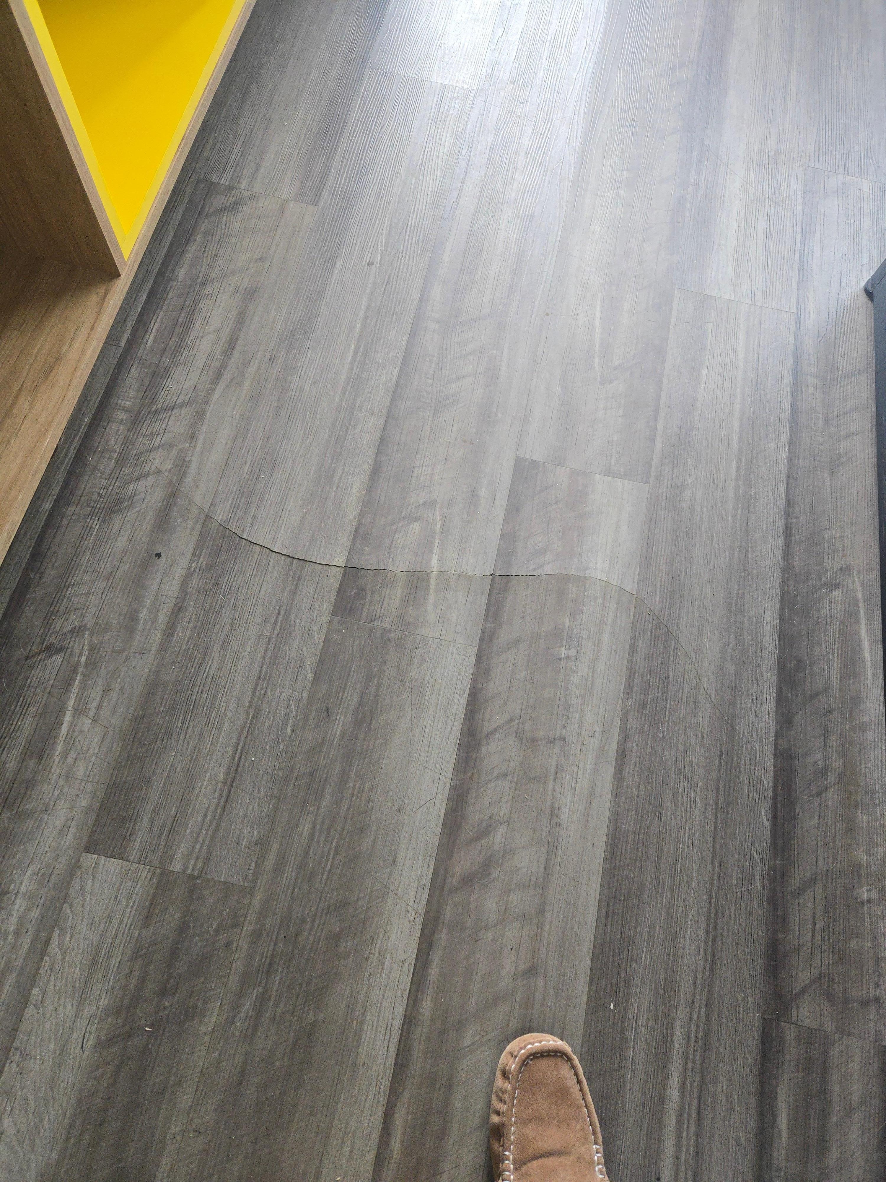 The middle of the floor because the water probably seeps under there. All the time. So that's buckling.