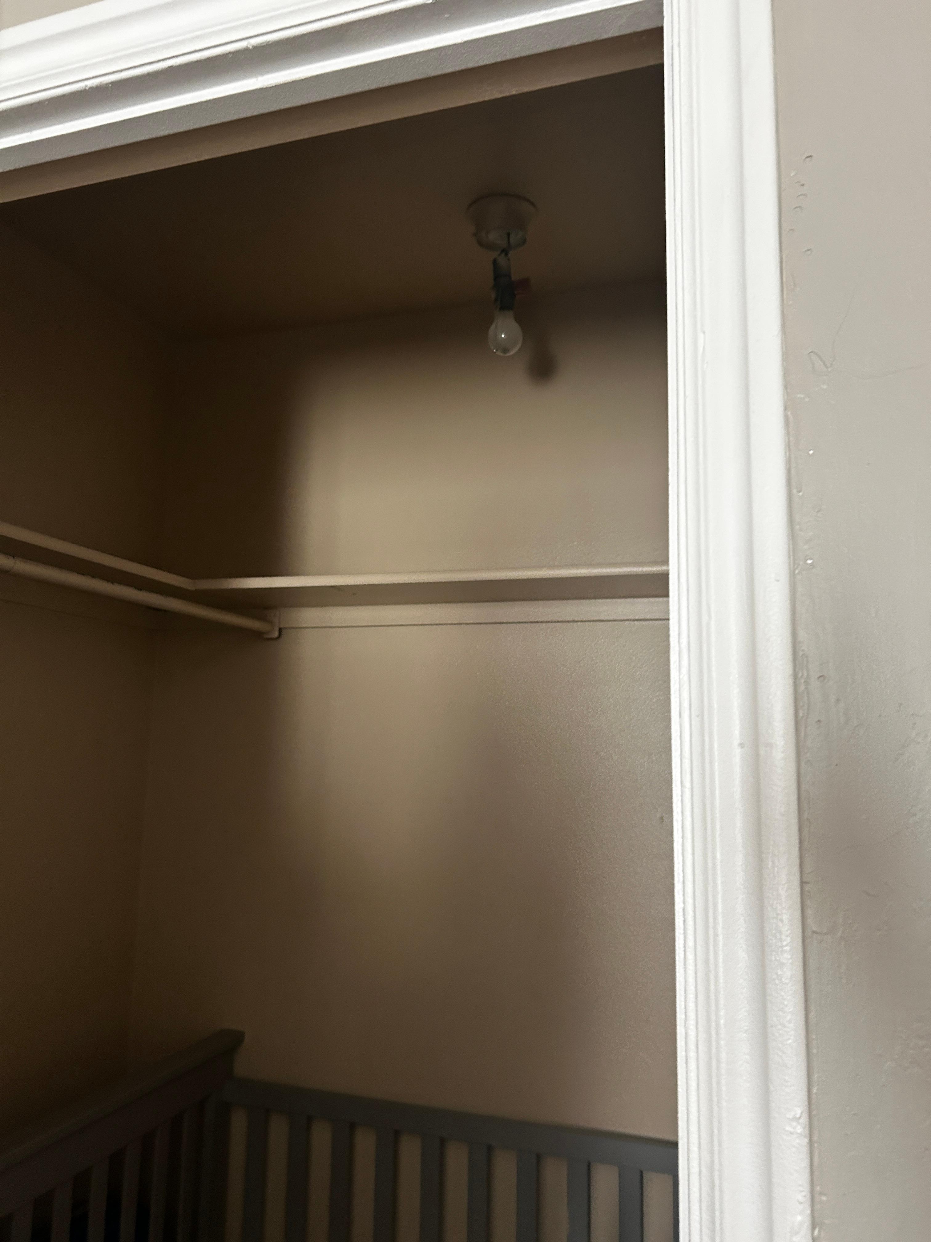 Closet off master with crib. No light cover. 