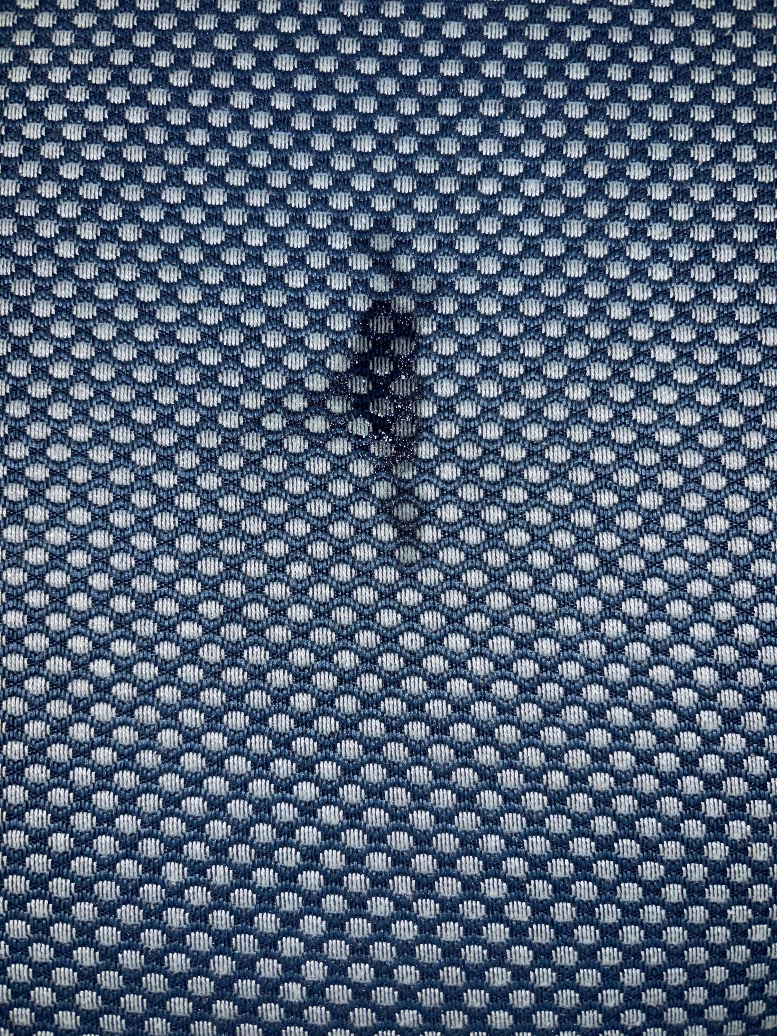 Stained cushion on corner sofa. 