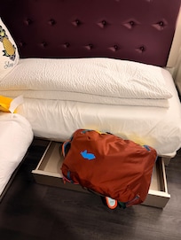 The under-bed luggage storage